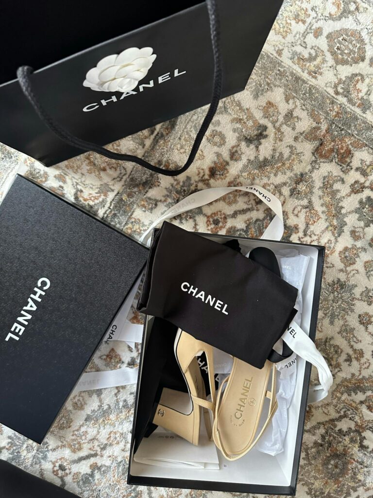 Chanel heels in elegant packaging convey luxury fashion and sophistication.