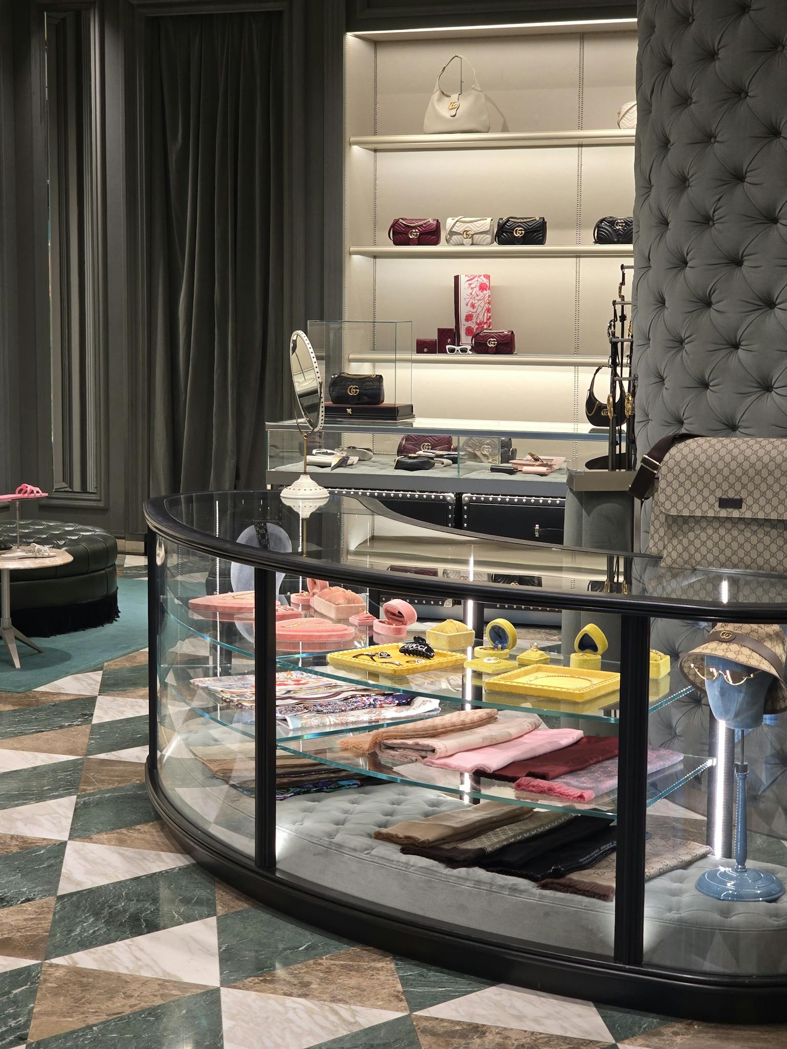 Elegant boutique showcasing luxury handbags and accessories on stylish displays.