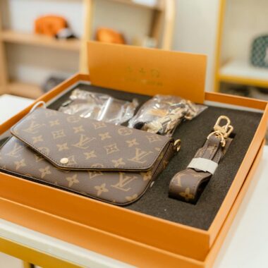 High-end Louis Vuitton monogram bag set displayed in a luxury boutique.